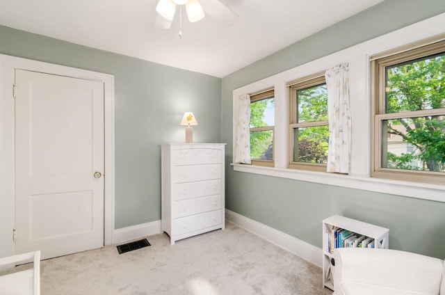 138 E Kelso Rd, Columbus, OH 43202 - sitting room with baseboards, healthy amount of natural light, carpet flooring, and a ceiling fan