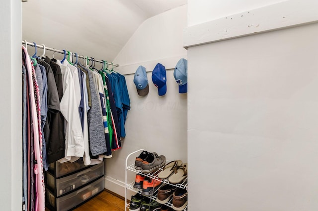 138 E Kelso Rd, Columbus, OH 43202 - spacious closet featuring vaulted ceiling and wood finished floors