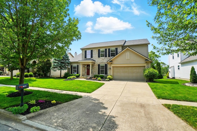 8073 Tree Lake Blvd, Powell, OH 43065 - traditional-style home with stone siding, a garage, concrete driveway, and a front lawn