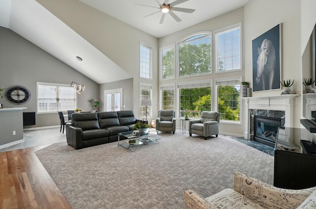 8073 Tree Lake Blvd, Powell, OH 43065 - living area featuring high vaulted ceiling, a ceiling fan, a premium fireplace, and wood finished floors