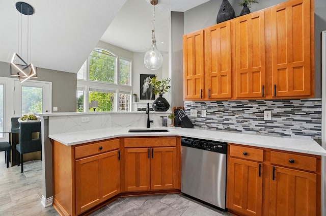 8073 Tree Lake Blvd, Powell, OH 43065 - kitchen with dishwasher, a peninsula, decorative backsplash, and hanging light fixtures