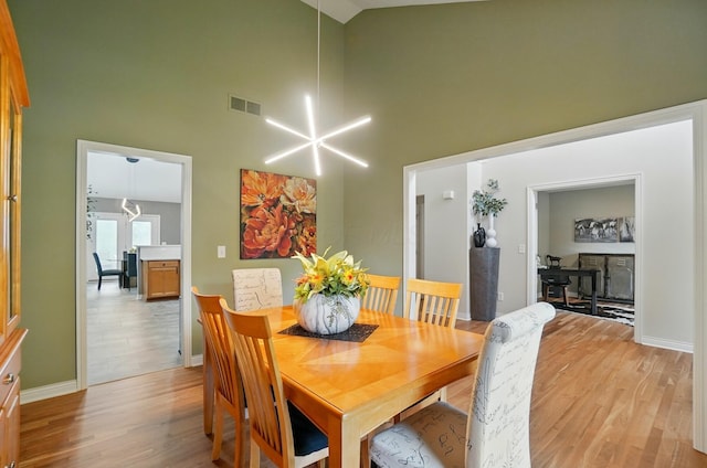 8073 Tree Lake Blvd, Powell, OH 43065 - dining space featuring high vaulted ceiling and light wood-type flooring