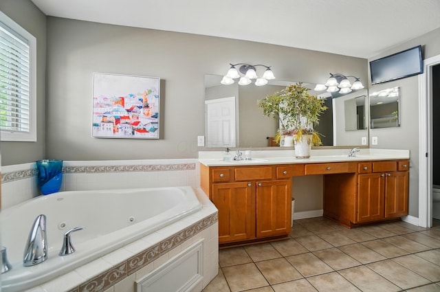 8073 Tree Lake Blvd, Powell, OH 43065 - bathroom with double vanity, a whirlpool tub, and tile patterned floors