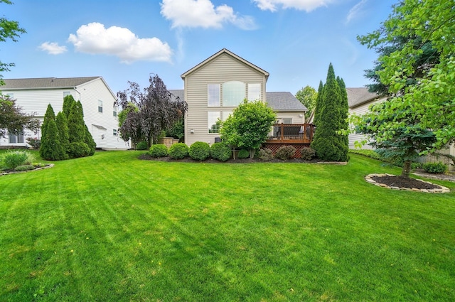8073 Tree Lake Blvd, Powell, OH 43065 - rear view of property with a lawn and a deck