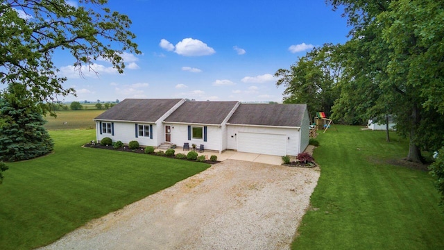 1875 Madden Higgins Rd, London, OH 43140 - view of front of home featuring dirt driveway, an attached garage, and a front lawn
