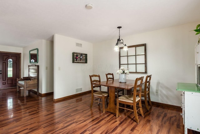 1875 Madden Higgins Rd, London, OH 43140 - dining area featuring wood finished floors, baseboards, and a chandelier