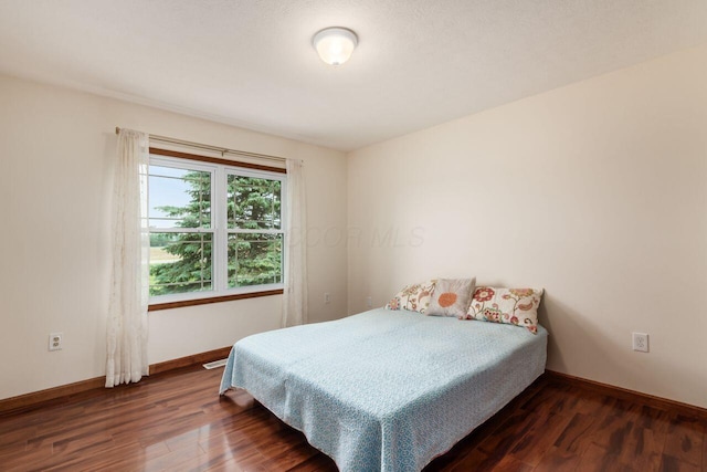 1875 Madden Higgins Rd, London, OH 43140 - bedroom featuring dark wood-style floors and baseboards