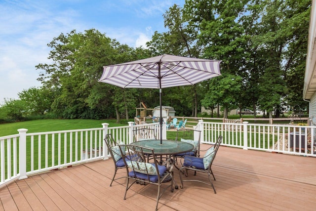 1875 Madden Higgins Rd, London, OH 43140 - deck with outdoor dining area and a lawn