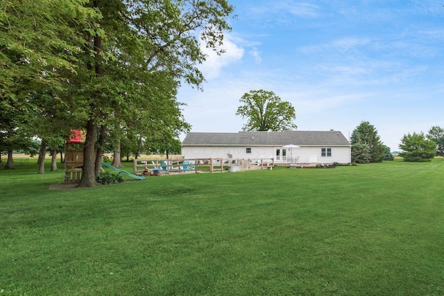 1875 Madden Higgins Rd, London, OH 43140 - rear view of house featuring a lawn and a deck
