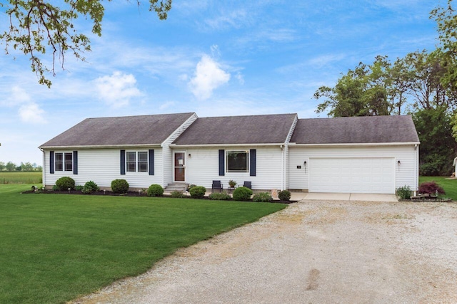1875 Madden Higgins Rd, London, OH 43140 - ranch-style home featuring dirt driveway, an attached garage, a front yard, and roof with shingles