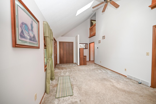 5467 Timpson Rd, Caledonia, OH 43314 - corridor featuring a skylight, light carpet, high vaulted ceiling, and baseboards