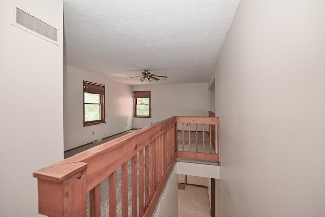5467 Timpson Rd, Caledonia, OH 43314 - corridor with an upstairs landing, a textured ceiling, and carpet