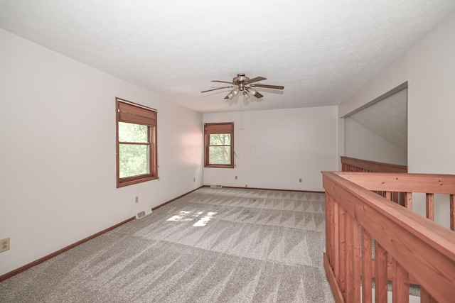 5467 Timpson Rd, Caledonia, OH 43314 - empty room featuring ceiling fan, light carpet, baseboards, and a textured ceiling