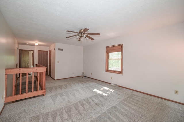 5467 Timpson Rd, Caledonia, OH 43314 - empty room with a ceiling fan, light colored carpet, baseboards, and a textured ceiling