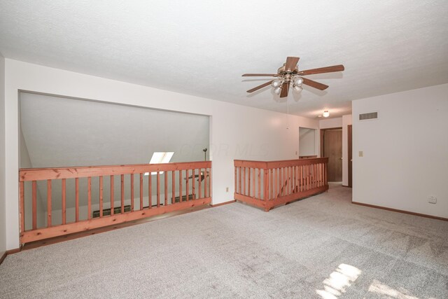 5467 Timpson Rd, Caledonia, OH 43314 - empty room with a ceiling fan, carpet flooring, baseboards, and a textured ceiling