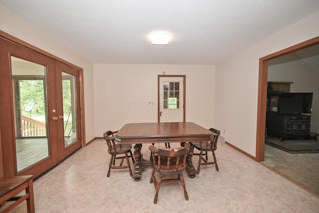 5467 Timpson Rd, Caledonia, OH 43314 - dining area featuring light carpet, baseboards, and french doors