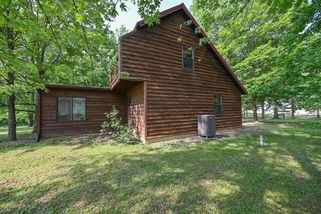 5467 Timpson Rd, Caledonia, OH 43314 - view of property exterior featuring a yard and central air condition unit