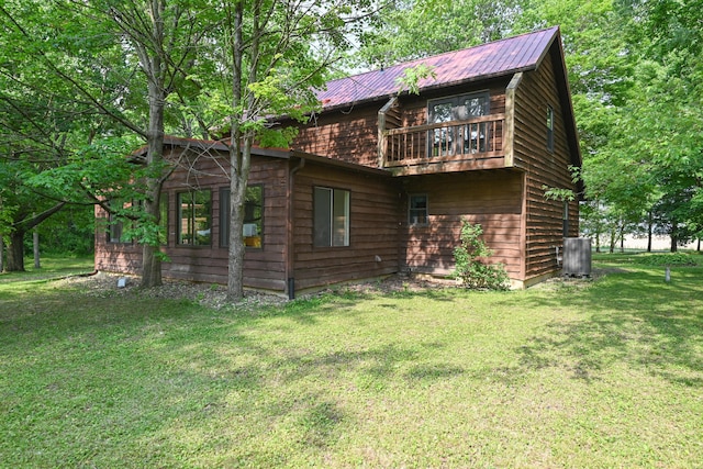 5467 Timpson Rd, Caledonia, OH 43314 - back of property featuring a lawn, metal roof, and cooling unit