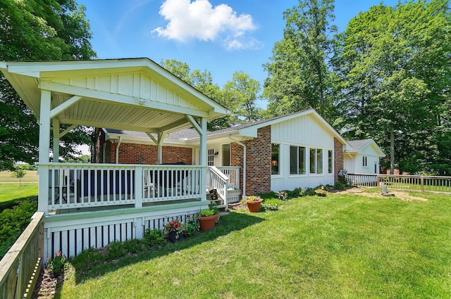 5350 Brook Rd NW, Lancaster, OH 43130 - view of front of property featuring brick siding, a porch, and board and batten siding