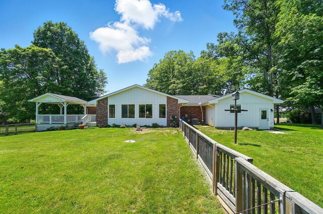 5350 Brook Rd NW, Lancaster, OH 43130 - rear view of house featuring brick siding and a wooden deck