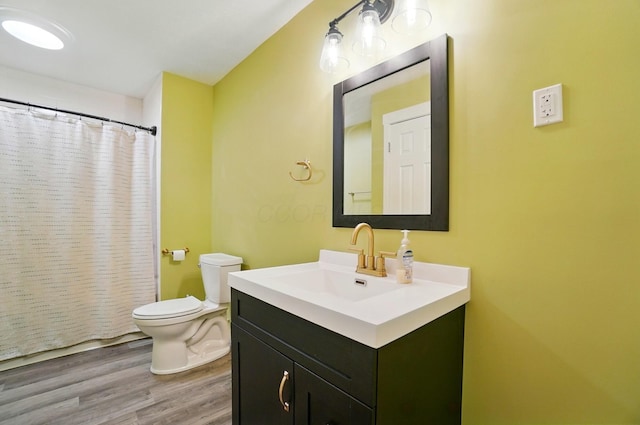 5350 Brook Rd NW, Lancaster, OH 43130 - bathroom with toilet, vanity, wood finished floors, and curtained shower