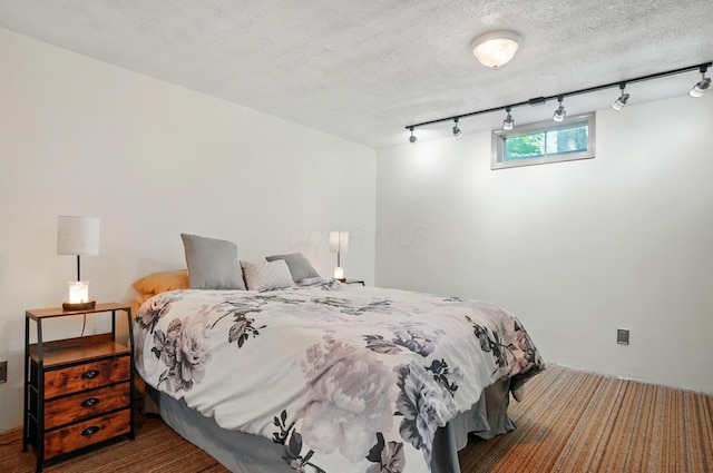 5350 Brook Rd NW, Lancaster, OH 43130 - bedroom with rail lighting and a textured ceiling