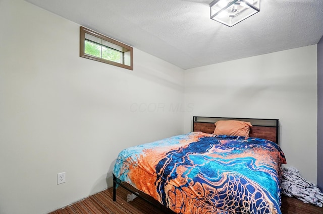 5350 Brook Rd NW, Lancaster, OH 43130 - bedroom with wood finished floors and a textured ceiling