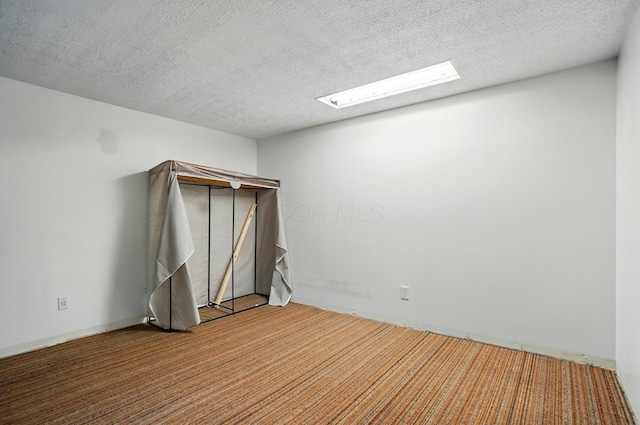 5350 Brook Rd NW, Lancaster, OH 43130 - carpeted empty room featuring a textured ceiling