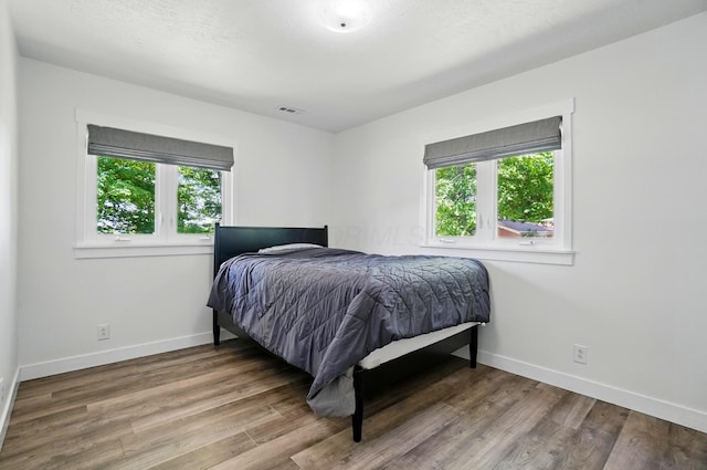 5350 Brook Rd NW, Lancaster, OH 43130 - bedroom with baseboards and wood finished floors