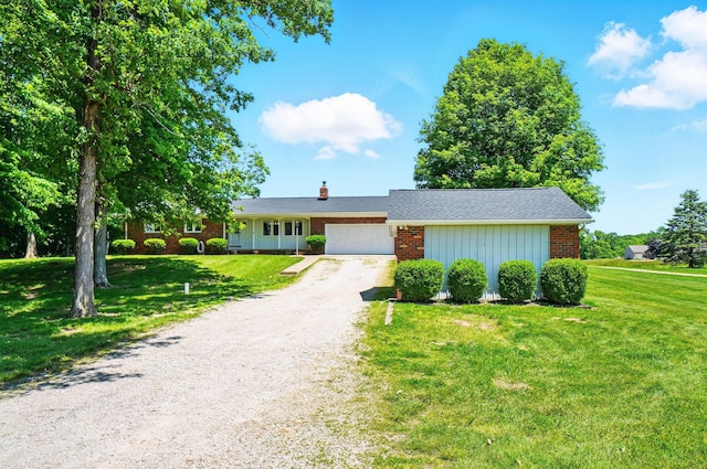 5350 Brook Rd NW, Lancaster, OH 43130 - single story home with brick siding, an attached garage, a front lawn, dirt driveway, and a chimney