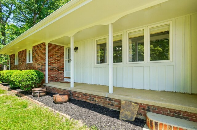 5350 Brook Rd NW, Lancaster, OH 43130 - entrance to property featuring a porch, board and batten siding, and brick siding