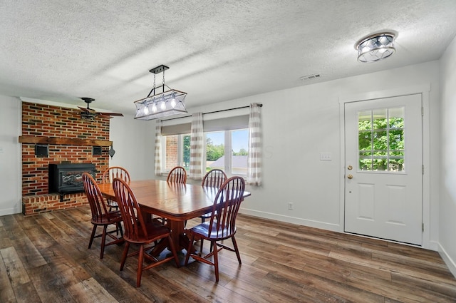 5350 Brook Rd NW, Lancaster, OH 43130 - dining room with dark wood-style floors, plenty of natural light, a textured ceiling, and baseboards