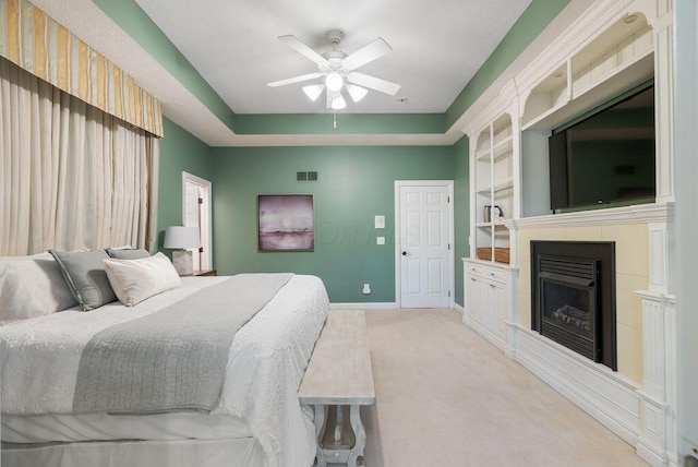 8467 Tartan Fields Dr, Dublin, OH 43017 - bedroom with a fireplace, baseboards, light carpet, and a ceiling fan