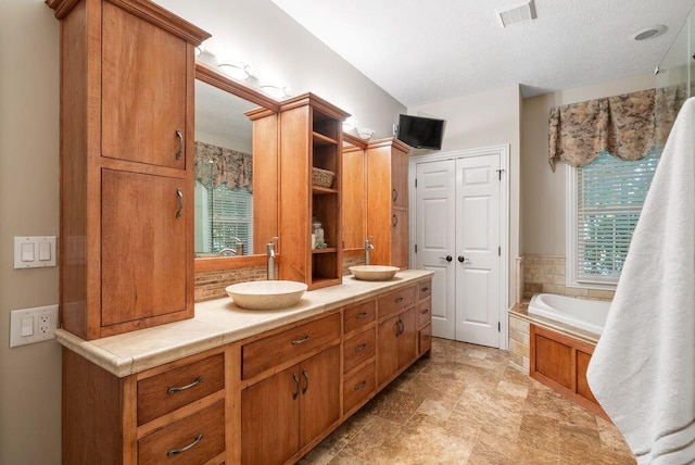 8467 Tartan Fields Dr, Dublin, OH 43017 - bathroom with double vanity and a garden tub