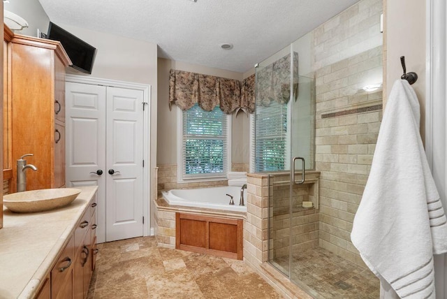8467 Tartan Fields Dr, Dublin, OH 43017 - full bath with a stall shower, a bath, a textured ceiling, and vanity