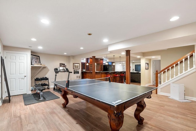 8467 Tartan Fields Dr, Dublin, OH 43017 - recreation room with baseboards, light wood finished floors, recessed lighting, and bar area