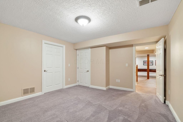 8467 Tartan Fields Dr, Dublin, OH 43017 - unfurnished bedroom with carpet floors, a textured ceiling, baseboards, and a closet