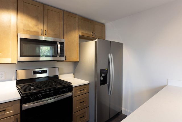 1210-1212 Dennison Ave, Columbus, OH 43201 - kitchen with appliances with stainless steel finishes, light countertops, and baseboards