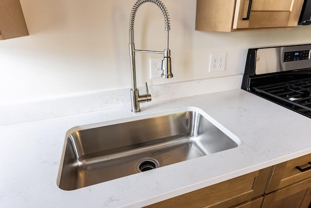1210-1212 Dennison Ave, Columbus, OH 43201 - kitchen view of a sink and brown cabinetry