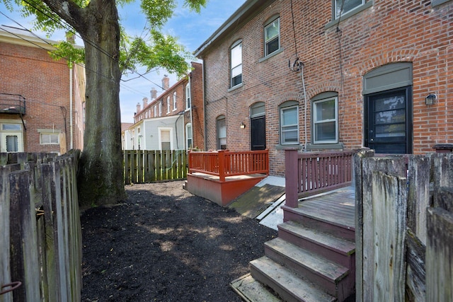 1210-1212 Dennison Ave, Columbus, OH 43201 - rear view of property featuring a deck and brick siding