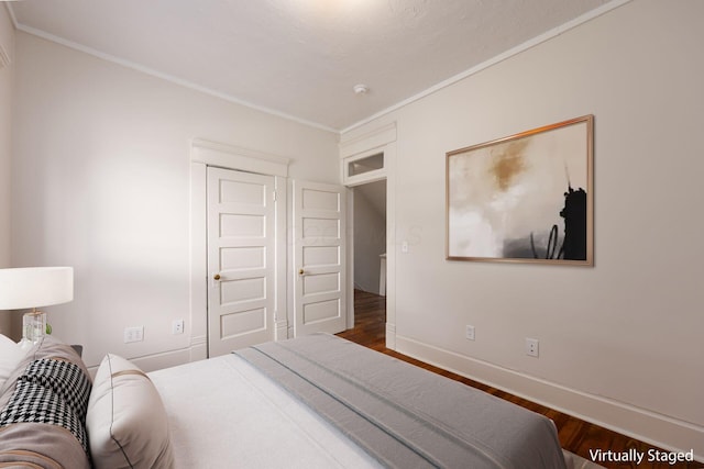 1210-1212 Dennison Ave, Columbus, OH 43201 - bedroom with wood finished floors, crown molding, and baseboards
