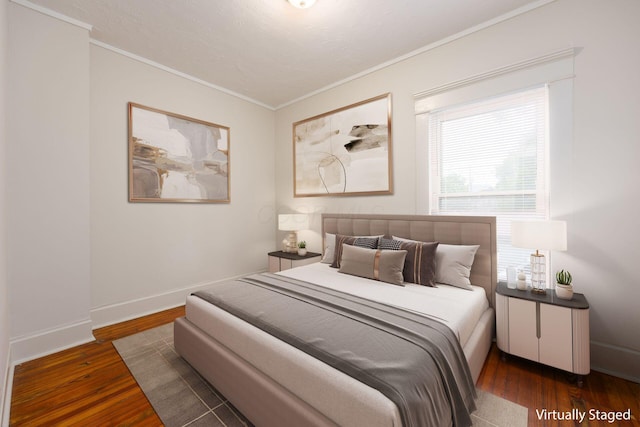 1210-1212 Dennison Ave, Columbus, OH 43201 - bedroom with crown molding, dark wood-type flooring, and baseboards
