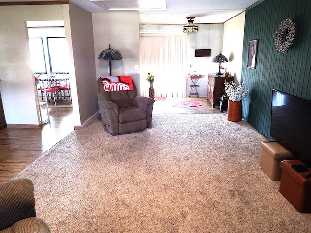 5082 Sutherland Dr, Columbus, OH 43207 - living area featuring healthy amount of natural light, wood finished floors, and baseboards