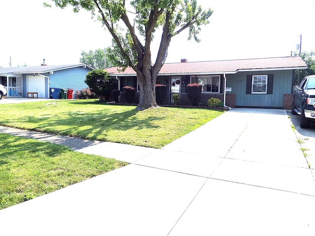 5082 Sutherland Dr, Columbus, OH 43207 - ranch-style home with concrete driveway and a front yard
