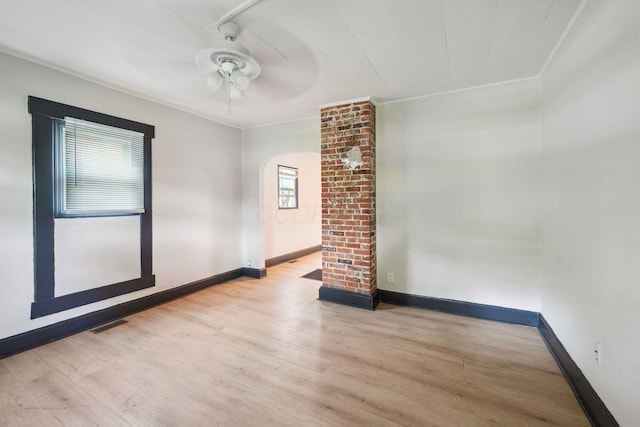 147 Schultz Ave, Columbus, OH 43222 - unfurnished room with a ceiling fan, wood finished floors, arched walkways, and ornamental molding
