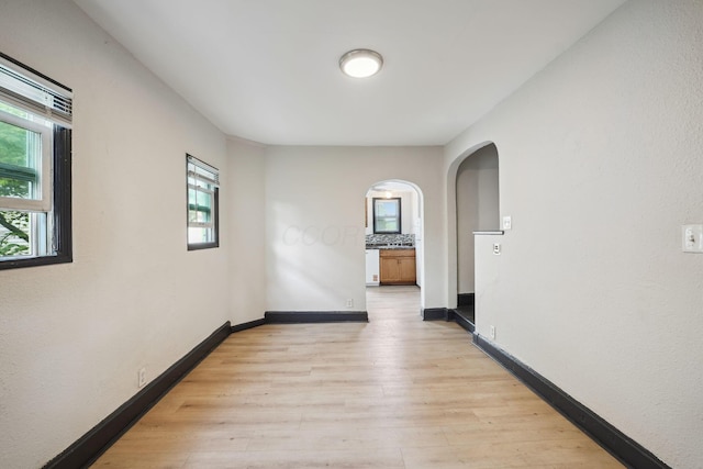 147 Schultz Ave, Columbus, OH 43222 - unfurnished room featuring arched walkways and light wood-type flooring