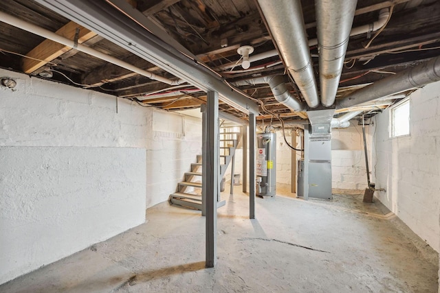 147 Schultz Ave, Columbus, OH 43222 - basement featuring water heater, heating unit, and stairs