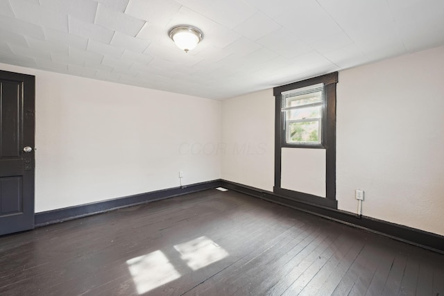 147 Schultz Ave, Columbus, OH 43222 - spare room with dark wood-type flooring and baseboards