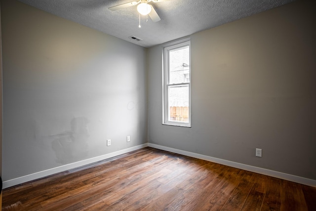 955 E Mound St, Columbus, OH 43205 - empty room featuring wood finished floors, baseboards, a ceiling fan, and a textured ceiling