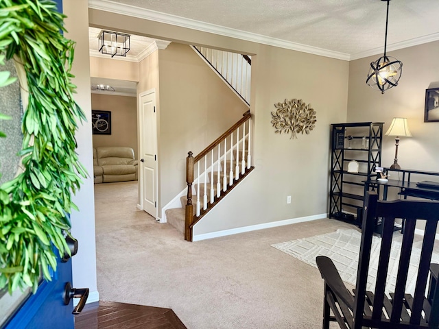 150 Shawnee Dr, Pickerington, OH 43147 - carpeted foyer featuring stairway, crown molding, baseboards, a chandelier, and a textured ceiling